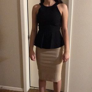 Black blouse with beige skirt